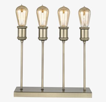 Foto av stilren bordslampa i mässing med fyra ljus