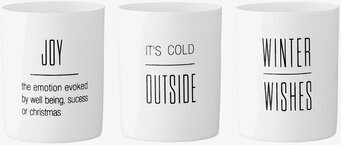 Bild med tre stilrena ljuslyktor för vinterdekoration