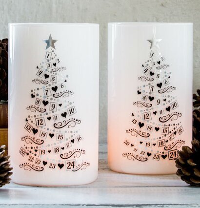 Bild av eleganta ljuslyktor med adventskalenderfunktion