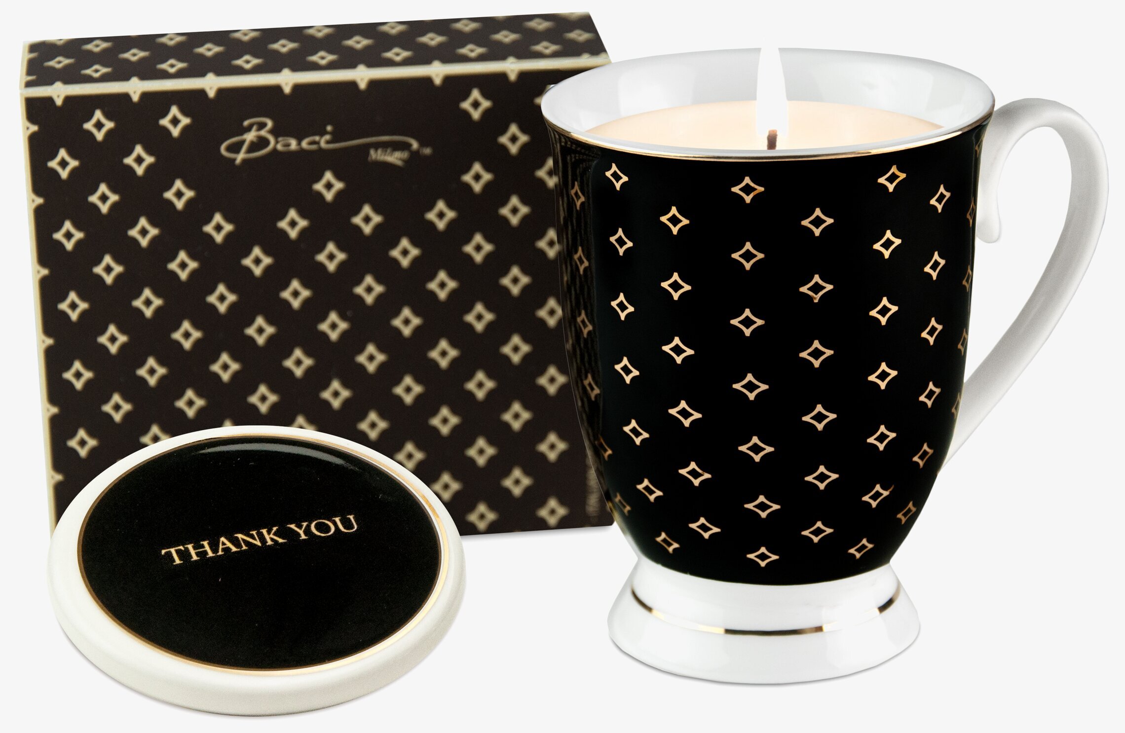 Foto av elegant doftljus i svart mugg med mönster