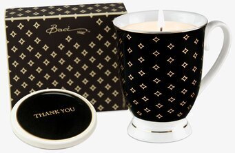 Foto av elegant doftljus i svart mugg med mönster