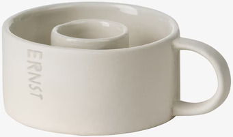 Bild av vit keramikljusstake med handtag och glans