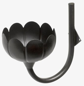 Foto av svart väggljusstake i stiliserad blomform
