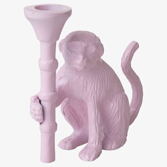 Bild av rosa apa ljusstake med unik och lekfull design