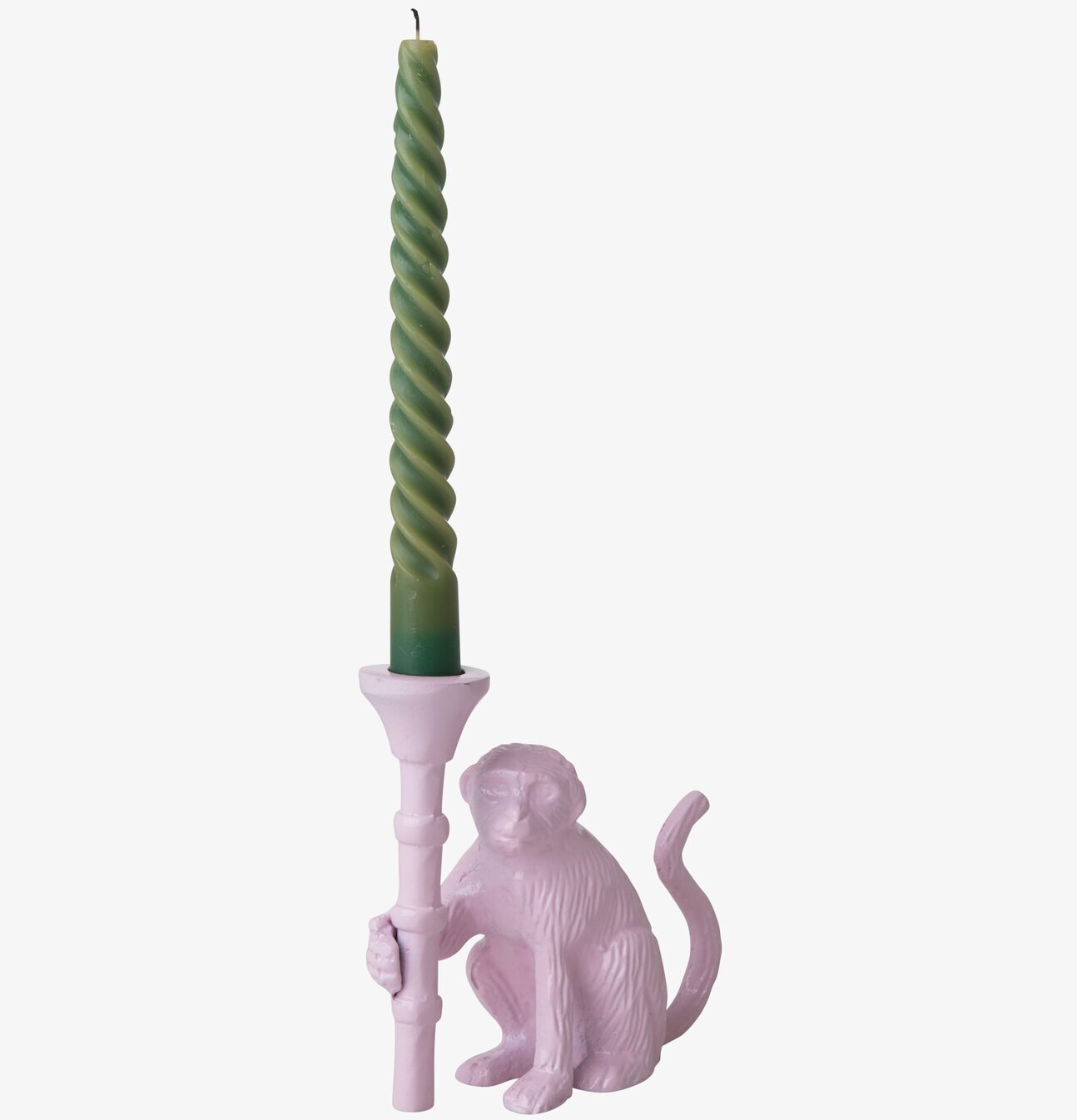 Foto av rosa apa-ljusstake med grönt spiralformat ljus