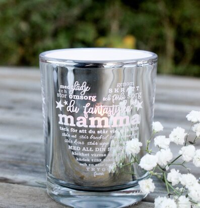 Bild av en elegant ljuslykta med inspirerande text