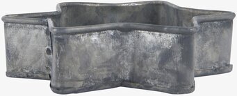 Bild av en stjärnformad ljusstake i rustik zinkfinish