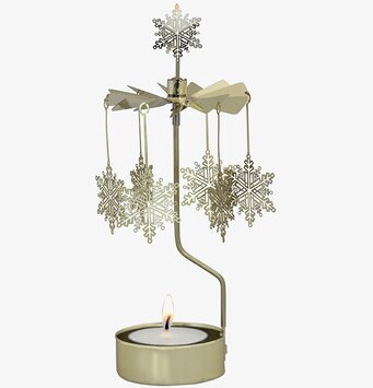 Bild av elegant ljuslykta med snurrande snöstjärnor