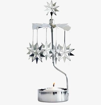 Foto av stilren ljusstake med snurrande stjärnor