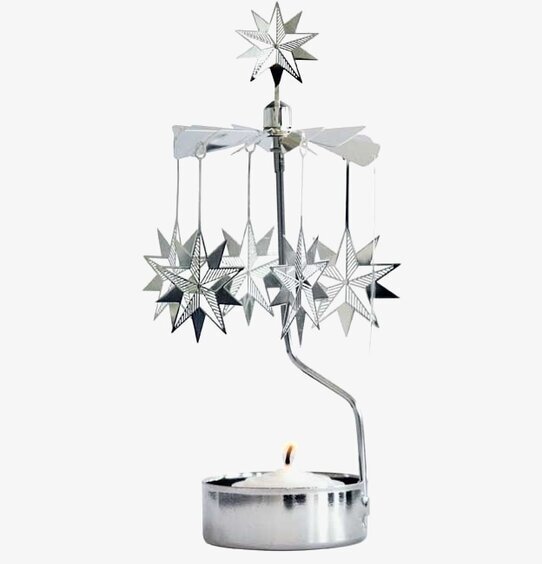 Foto av stilren ljusstake med snurrande stjärnor