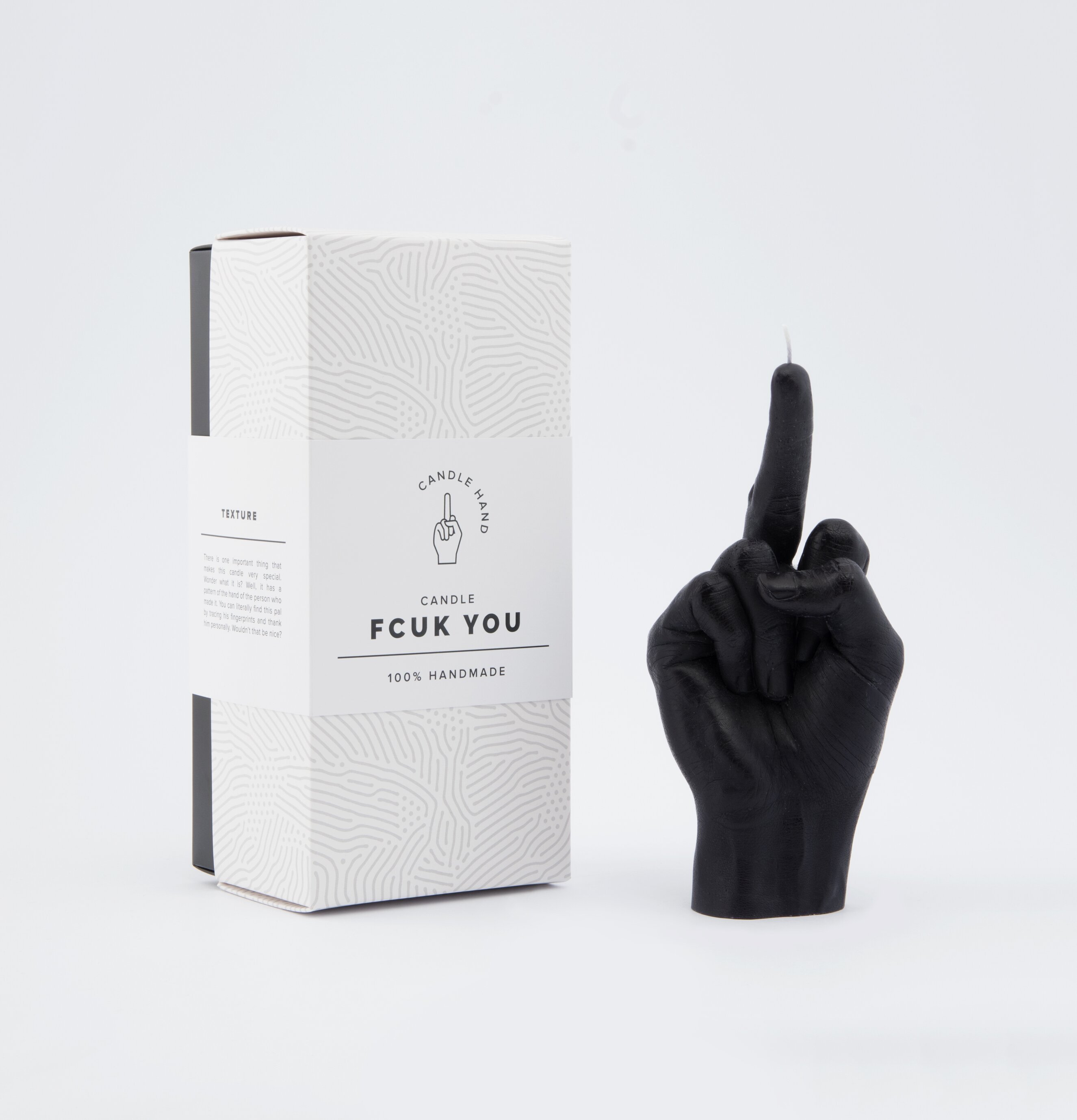 Foto av ett unikt, handformat ljus i svart design