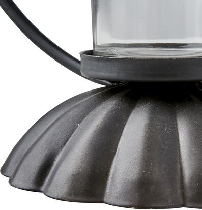 Foto av elegant värmeljushållare i metall och glas