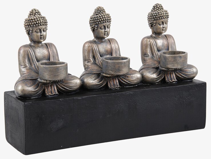 Bild av detaljrik ljushållare med Buddha-figurer