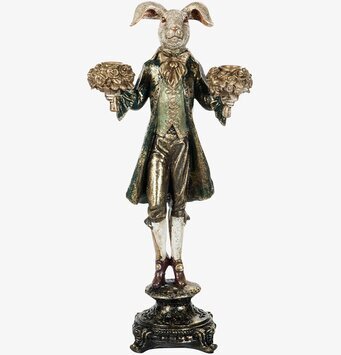 Foto av detaljerad ljusstake med kanin i mörkgrönt