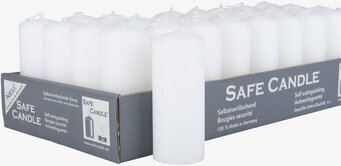 Bild av vita cylinderformade ljus i kartongförpackning