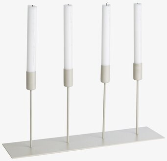 Bild av stilren ljusstake med fyra ljus och beige ton