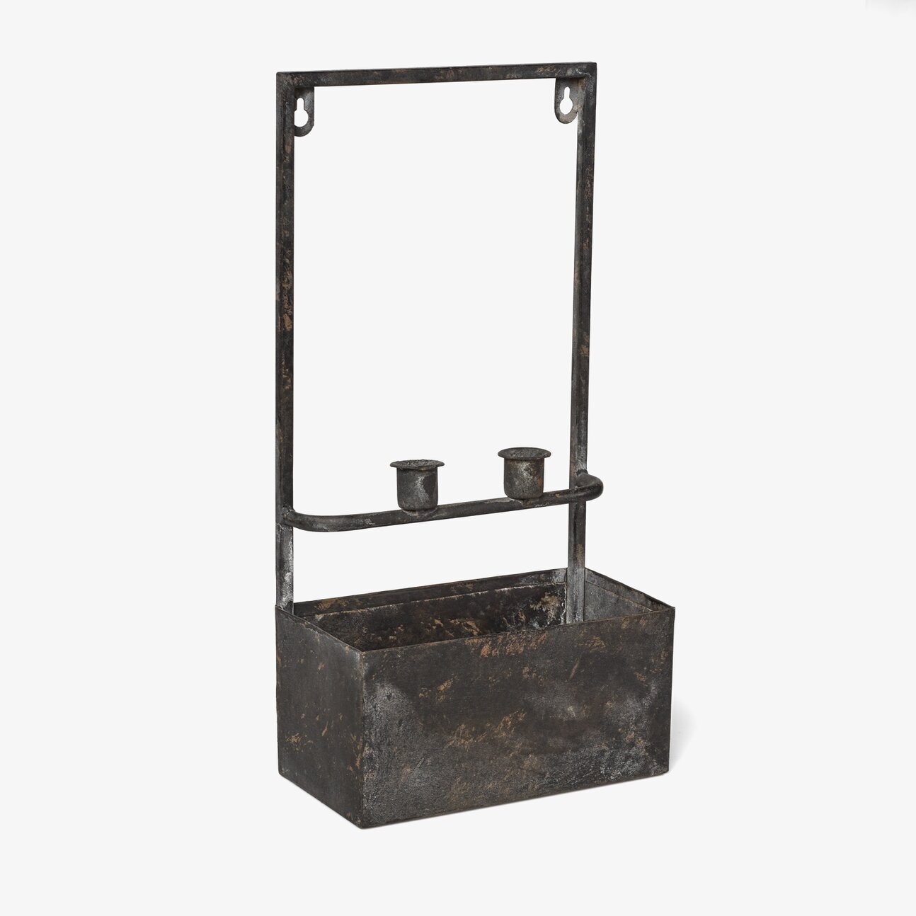 Foto av väggmonterad ljushållare med plantering