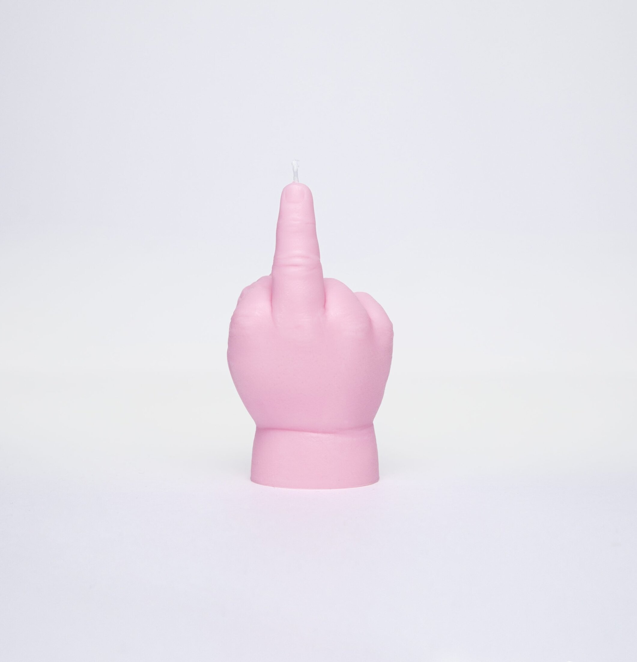 Bild av ljuslykta formad som en hand i rosa nyans
