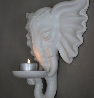 Foto av elegant väggmonterad elefant ljushållare