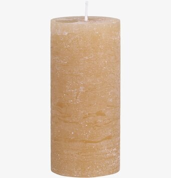 Bild av cylinderformat blockljus med rustik känsla