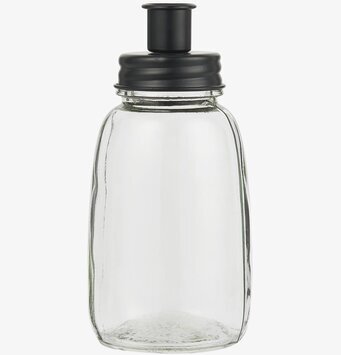 Foto av elegant ljusstake i glas och metall