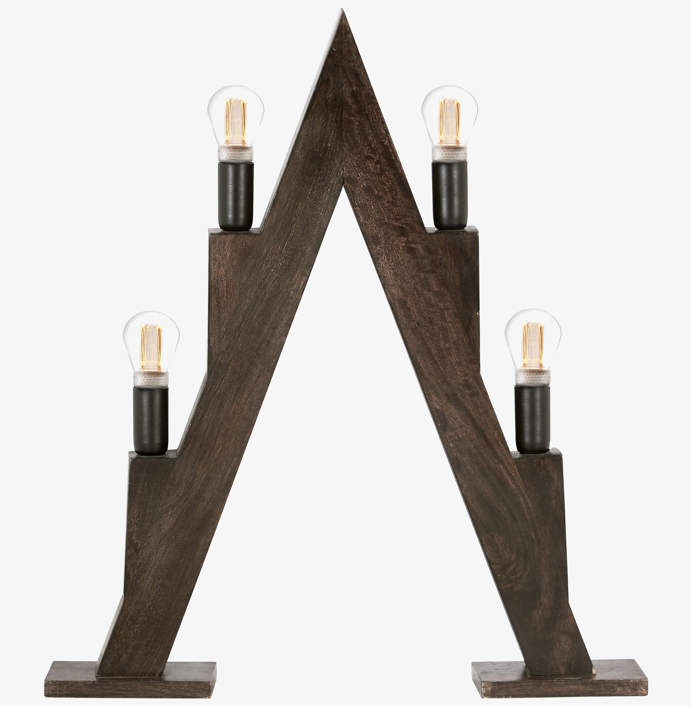 Foto av geometrisk ljusstake i mörkt trä med glödlampor