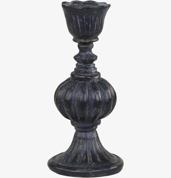 Bild av antiksvart ljusstake med rustik design