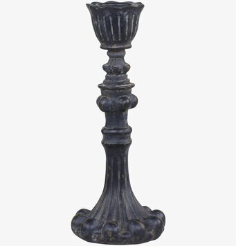 Foto av antiksvart ljusstake med detaljerad design