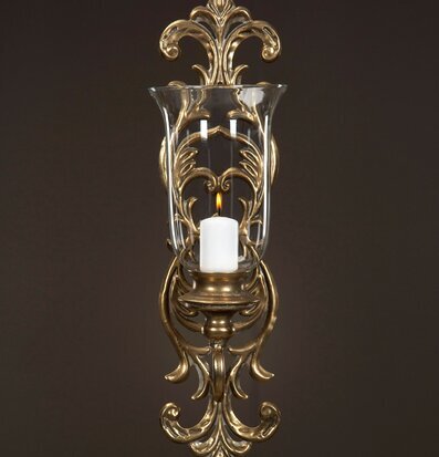 Bild av elegant väggmonterad ljushållare i guldbrun