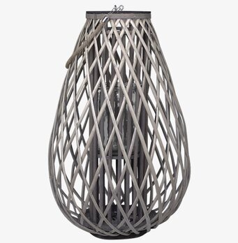 Foto av stor flätad pillykta med glas och repdetaljer