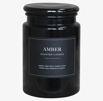 Bild av stilren ljusburk med doftnoter och design