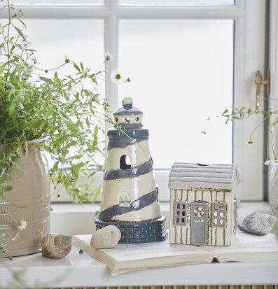 Ljuslykta Fyr Løkken från IB Laursen på fönsterbräda