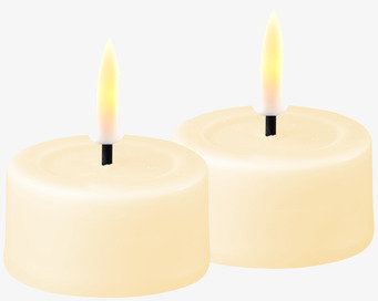 Foto av krämfärgade LED-värmeljus med realistisk låga