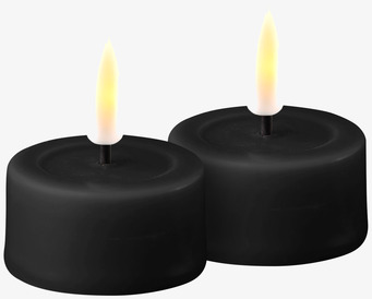 Bild av moderna och säkra LED-värmeljus i svart