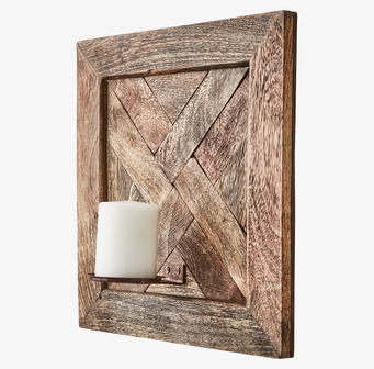 Bild av elegant brun väggljushållare med ljus