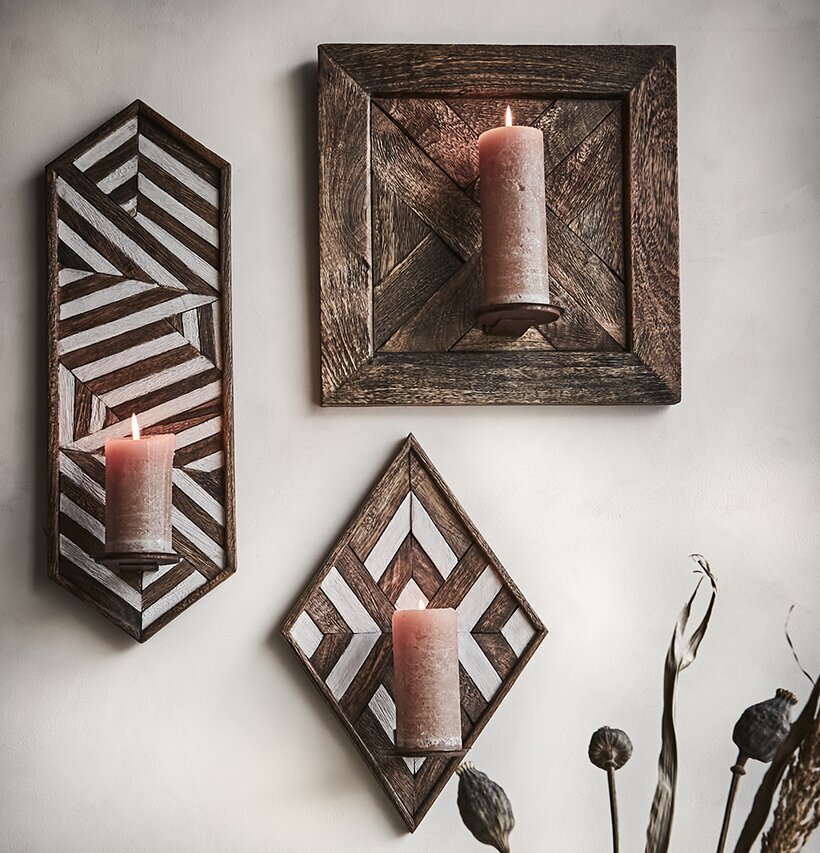 Bild av vackra väggljushållare i geometriska former