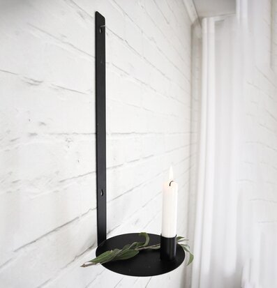 Foto av elegant väggljusstake i svart metall