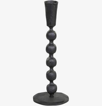 Foto av antiksvart ljusstake med klassisk design