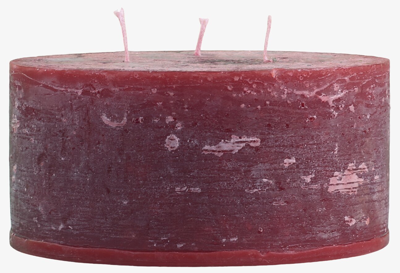 Bild av mörkrött blockljus med hantverkskänsla