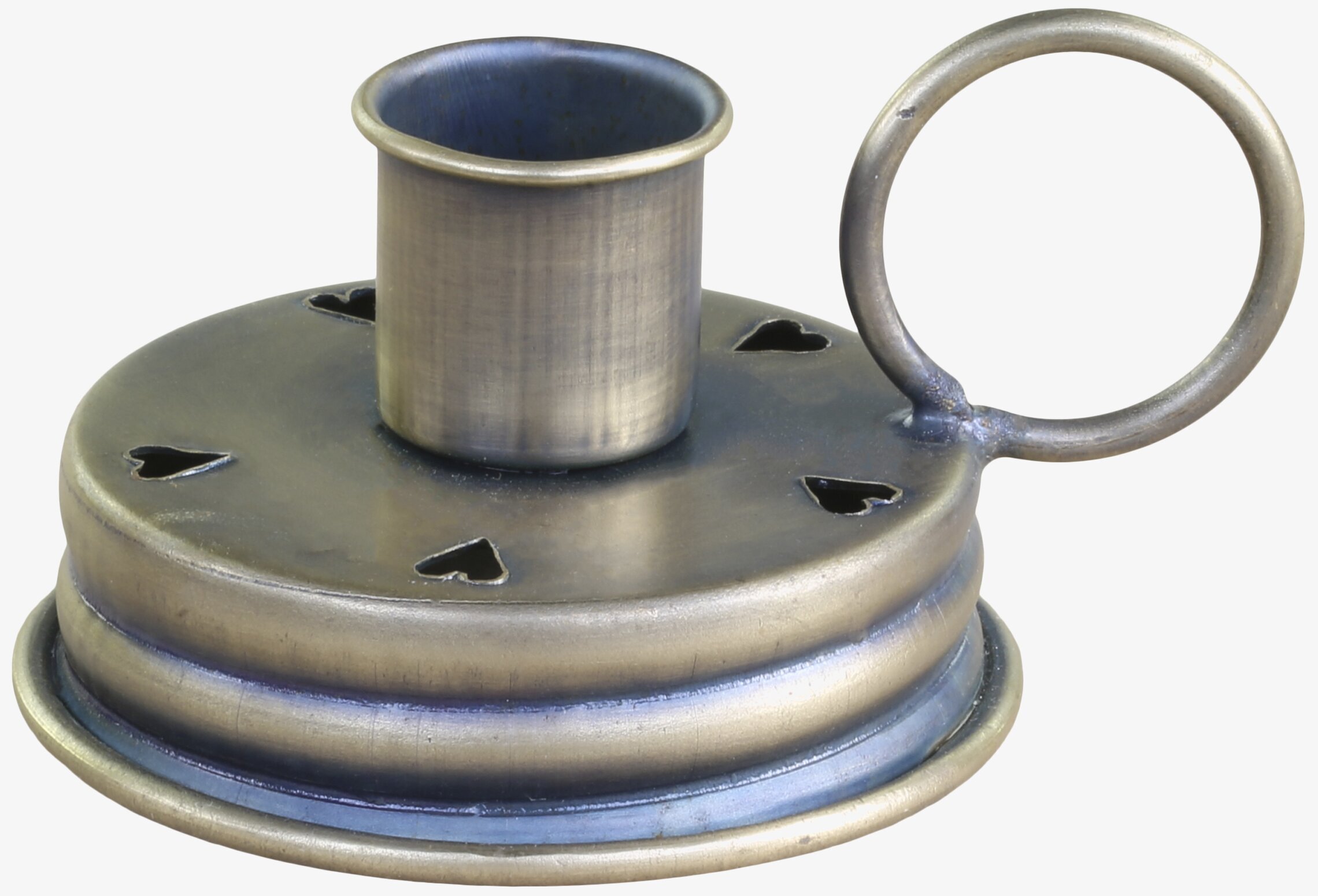 Bild av antik mässingsljusstake med hjärtdetaljer