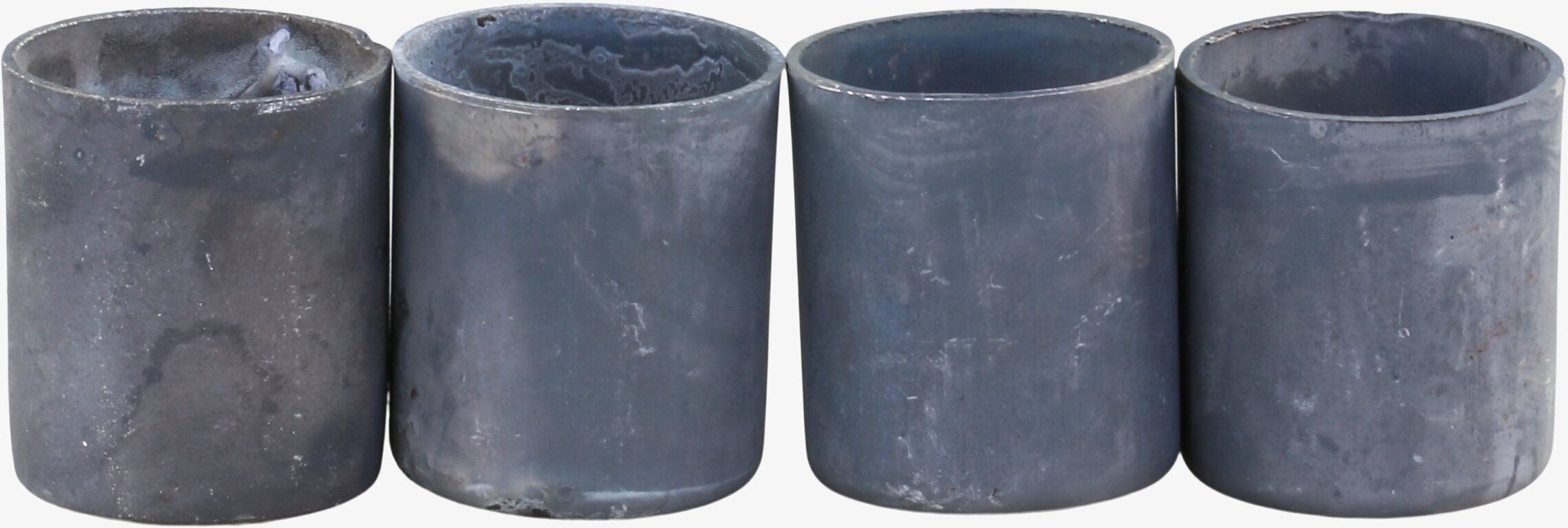 Bild av rustika cylindriska ljushållare i zinkfinish