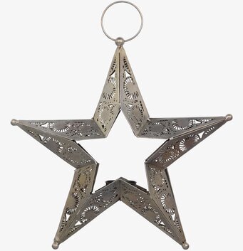 Foto av hängande stjärnformad lykta i metall