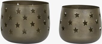 Bild av två ljuslyktor i antik mässing med stjärndesign