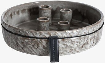 Foto av stilren ljusstake i keramik med naturtoner