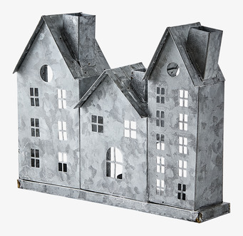 Bild av en unik ljuslykta i metall med rå finish