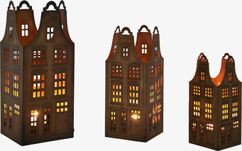 Bild av tre unika ljushållare i metall och mässing