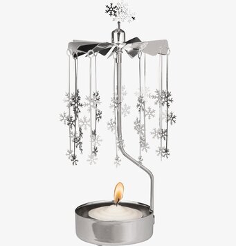 Bild av dekorativ ljuslykta med roterande snöflingor