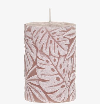 Bild av blockljus med intrikat bladmönster i rosa ton