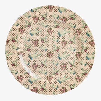 Bild av serveringsfat med duvmotiv och eleganta detaljer