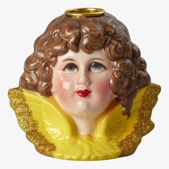 Bild av detaljrik ljushållare med gyllene detaljer